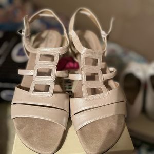 Ladies dress sandals.  Ivory/blush in color with a shiny finish.  Barely worn.